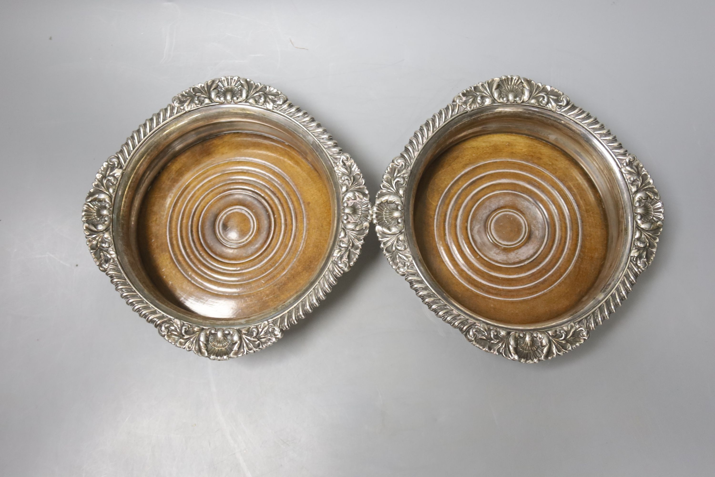 A pair of Victorian plated wine coasters, largest 17cm